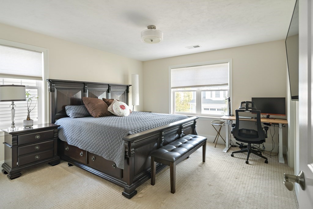 25 Oxbow Road, Unit 25 Framingham, MA 01701 - Photo 29 of 34 a bedroom with a bed and a window