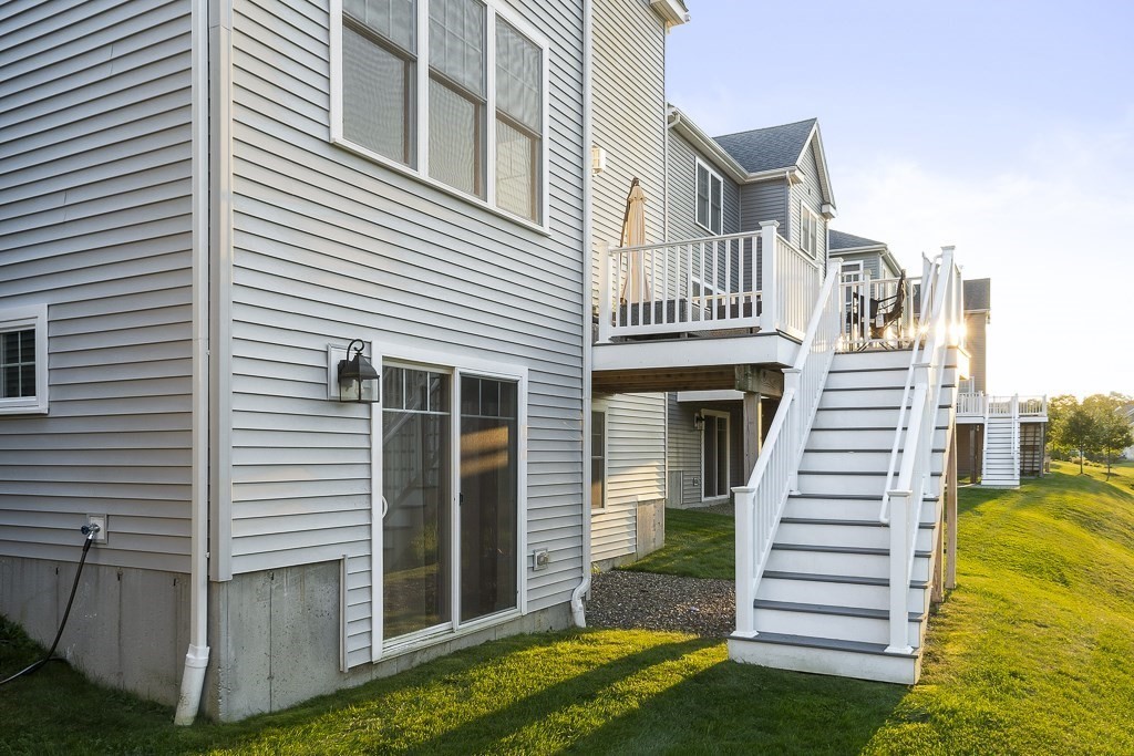 25 Oxbow Road, Unit 25 Framingham, MA 01701 - Photo 32 of 34 a front view of a house with a yard