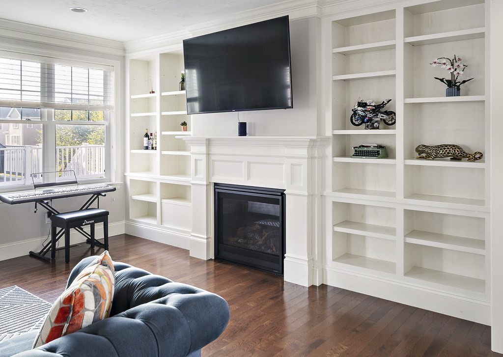 25 Oxbow Road, Unit 25 Framingham, MA 01701 - Photo 8 of 34 a living room with furniture and a flat screen tv