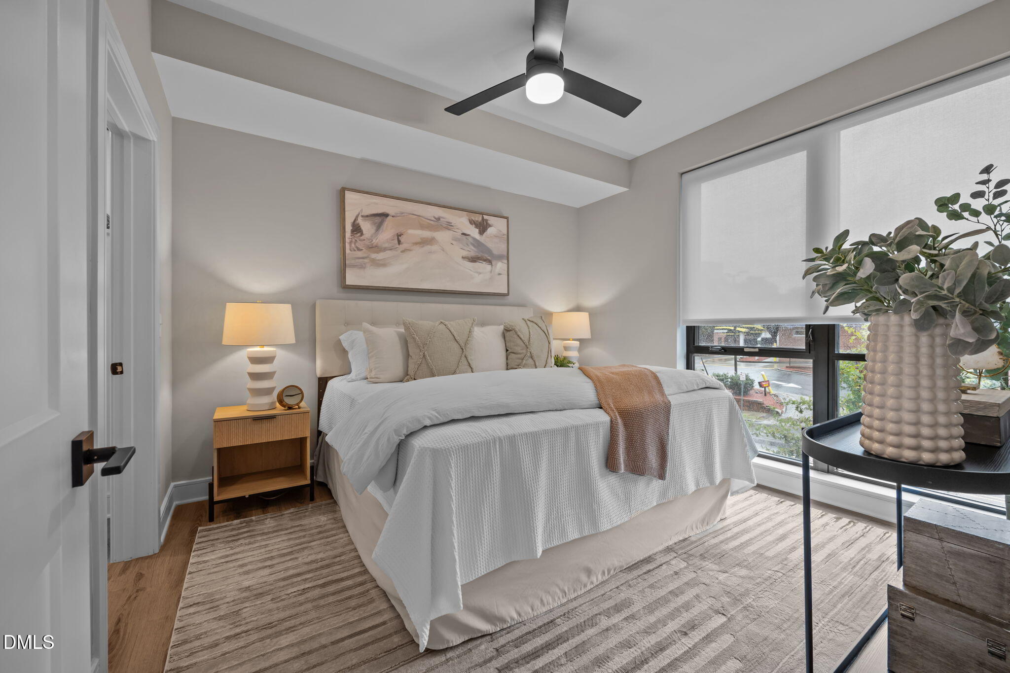 615 West Peace Street, Unit 202 Raleigh, NC 27603 - Photo 13 of 24 a bedroom with bed and window