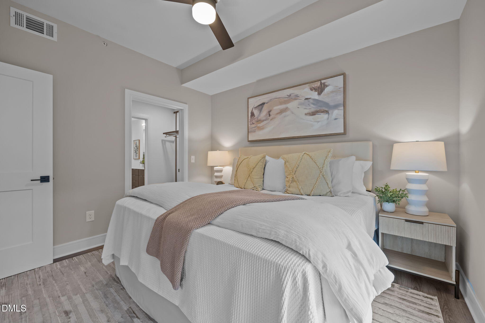 615 West Peace Street, Unit 202 Raleigh, NC 27603 - Photo 14 of 24 a bedroom with bed and a chandelier