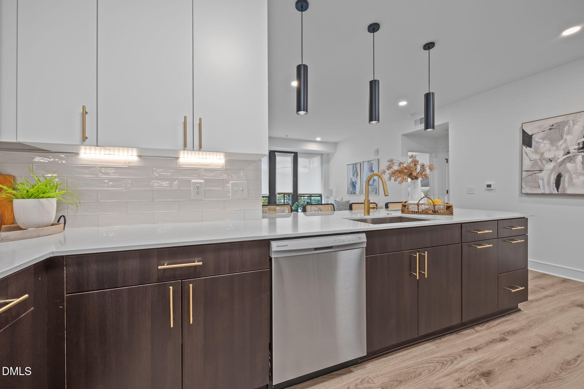 615 West Peace Street, Unit 202 Raleigh, NC 27603 - Photo 5 of 24 a kitchen with stainless steel appliances sink cabinets and window