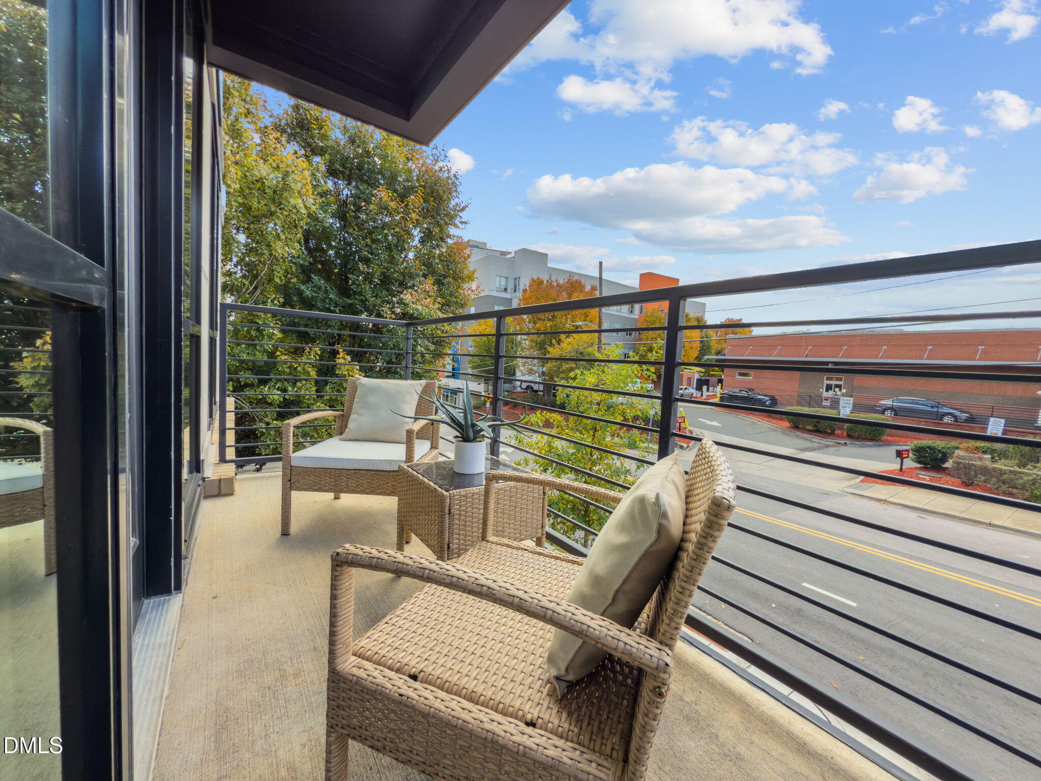 615 West Peace Street, Unit 202 Raleigh, NC 27603 - Photo 8 of 24 a view of a balcony with chairs