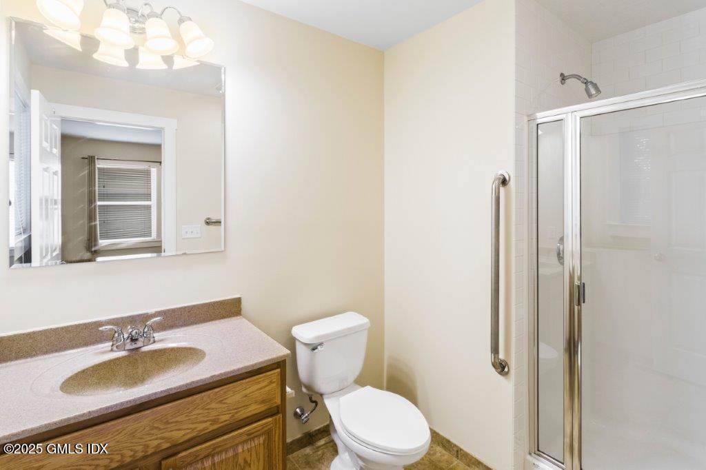 18 Charles Street, Unit B Greenwich, CT 06830 - Photo 12 of 14 a bathroom with a sink toilet and shower