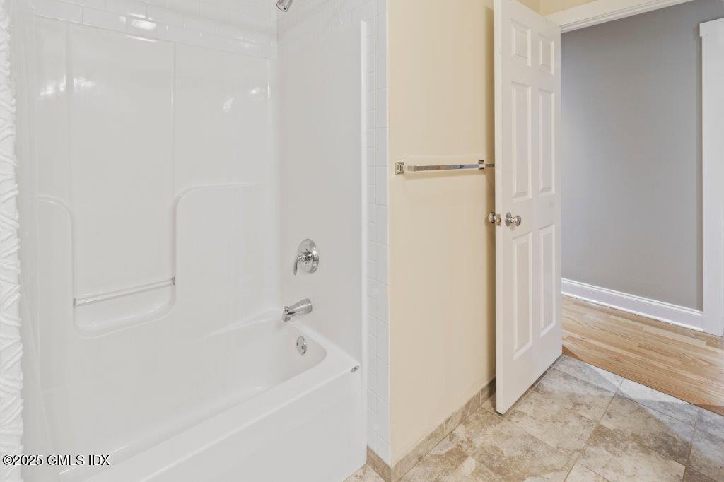 18 Charles Street, Unit B Greenwich, CT 06830 - Photo 9 of 14 a bathroom with a bathtub and a shower