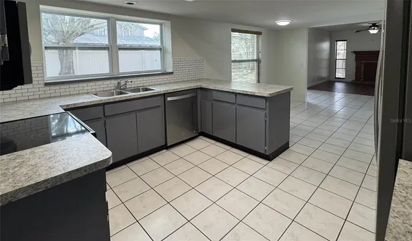 a kitchen with a sink and cabinets