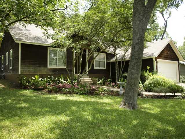 4015 Cherrywood Road Austin, TX 78722 - Photo 1 of 1 a front view of a house with a yard