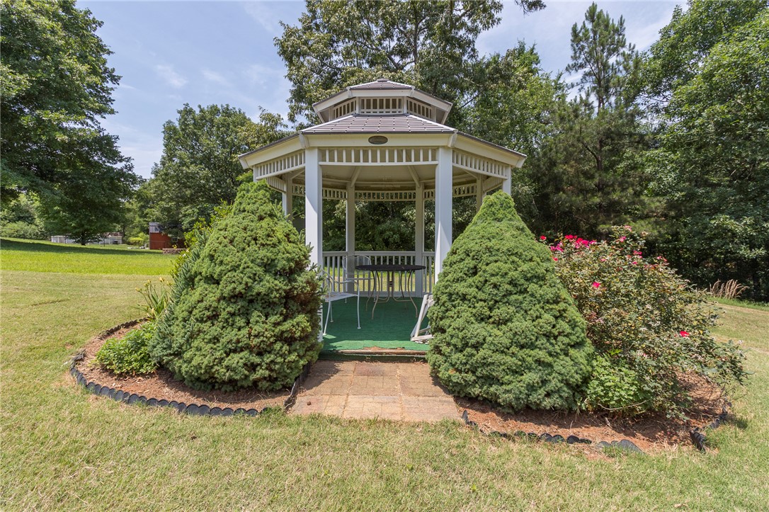 861 North Old Pendleton Road Liberty, SC 29657 - Photo 38 of 45 A charming gazebo nestled in a verdant landscape, perfect for outdoor leisure.