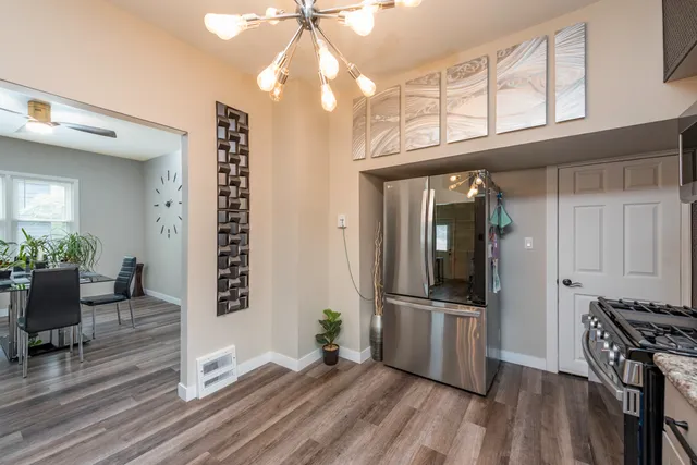 a view of a livingroom with furniture and hardwood floor