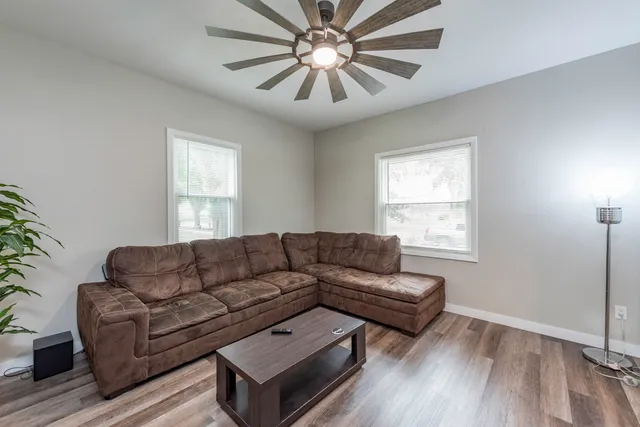 a living room with furniture and a window
