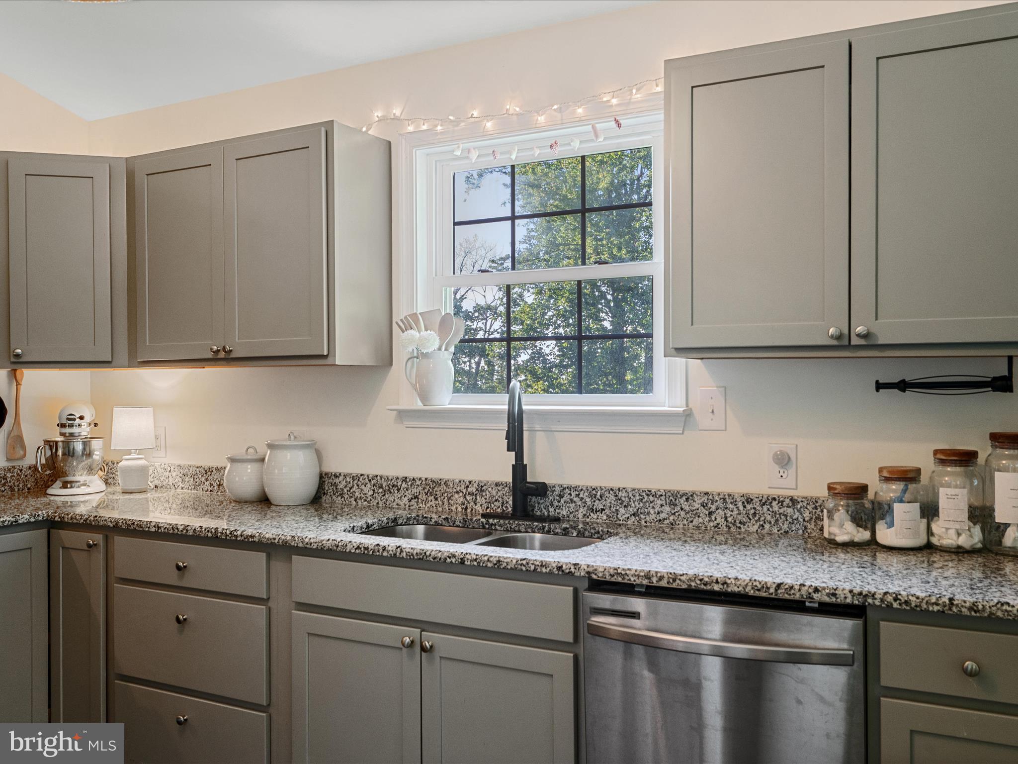439 Windy Way Front Royal, VA 22630 - Photo 18 of 40 a kitchen with granite countertop a sink window and cabinets
