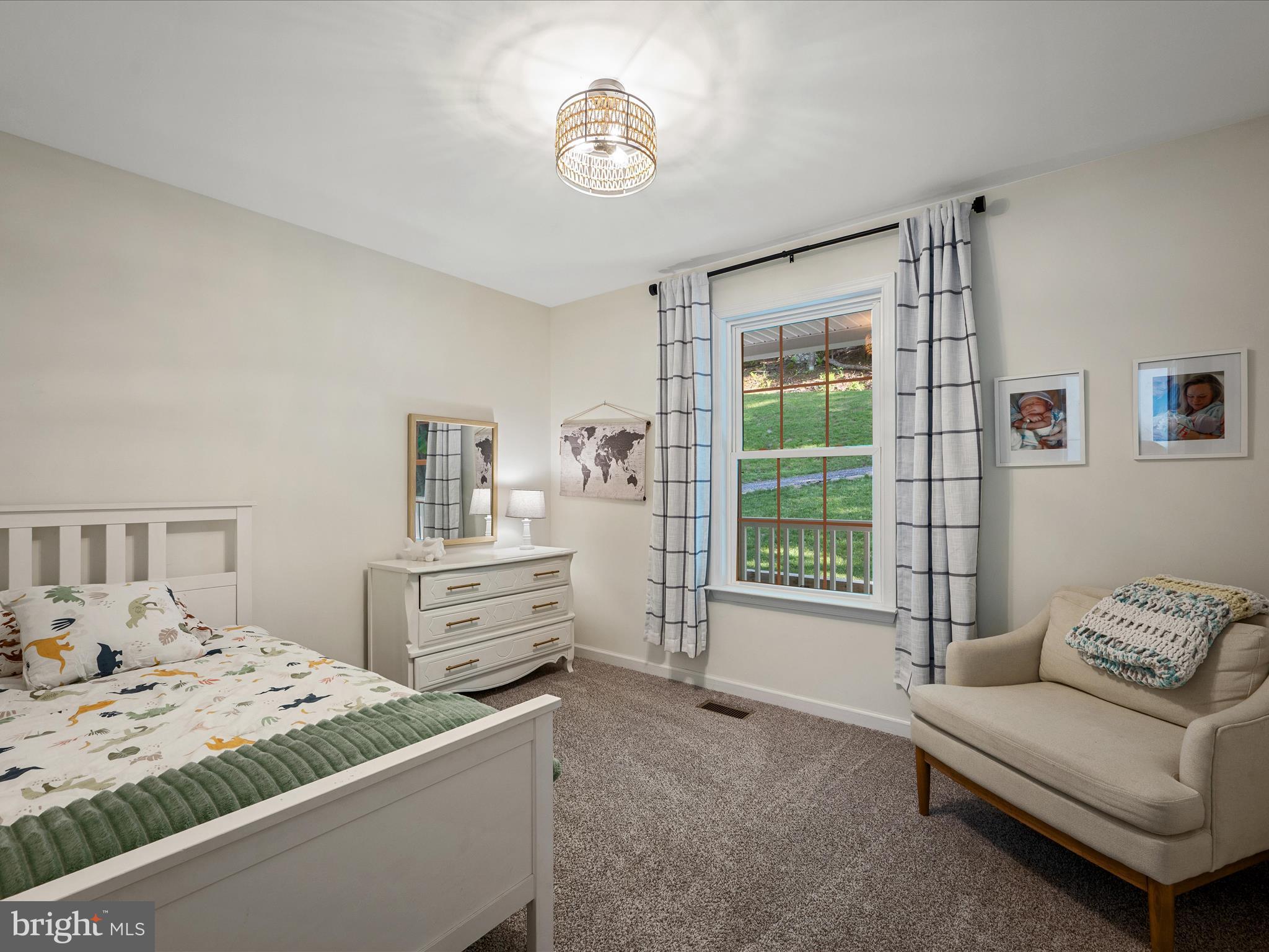 439 Windy Way Front Royal, VA 22630 - Photo 19 of 40 a bedroom with a bed and a couch