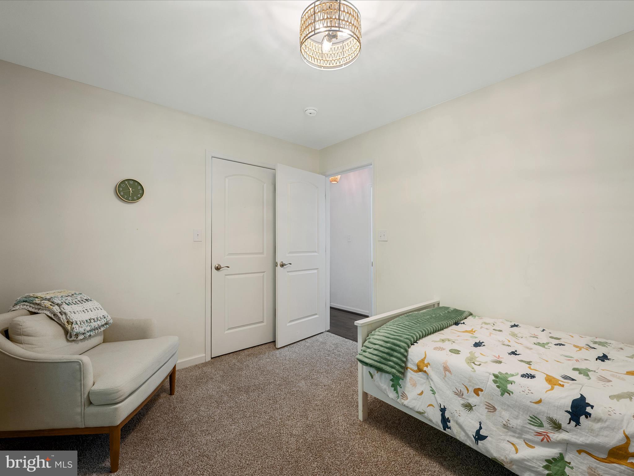 439 Windy Way Front Royal, VA 22630 - Photo 20 of 40 a bedroom with a bed and a chandelier