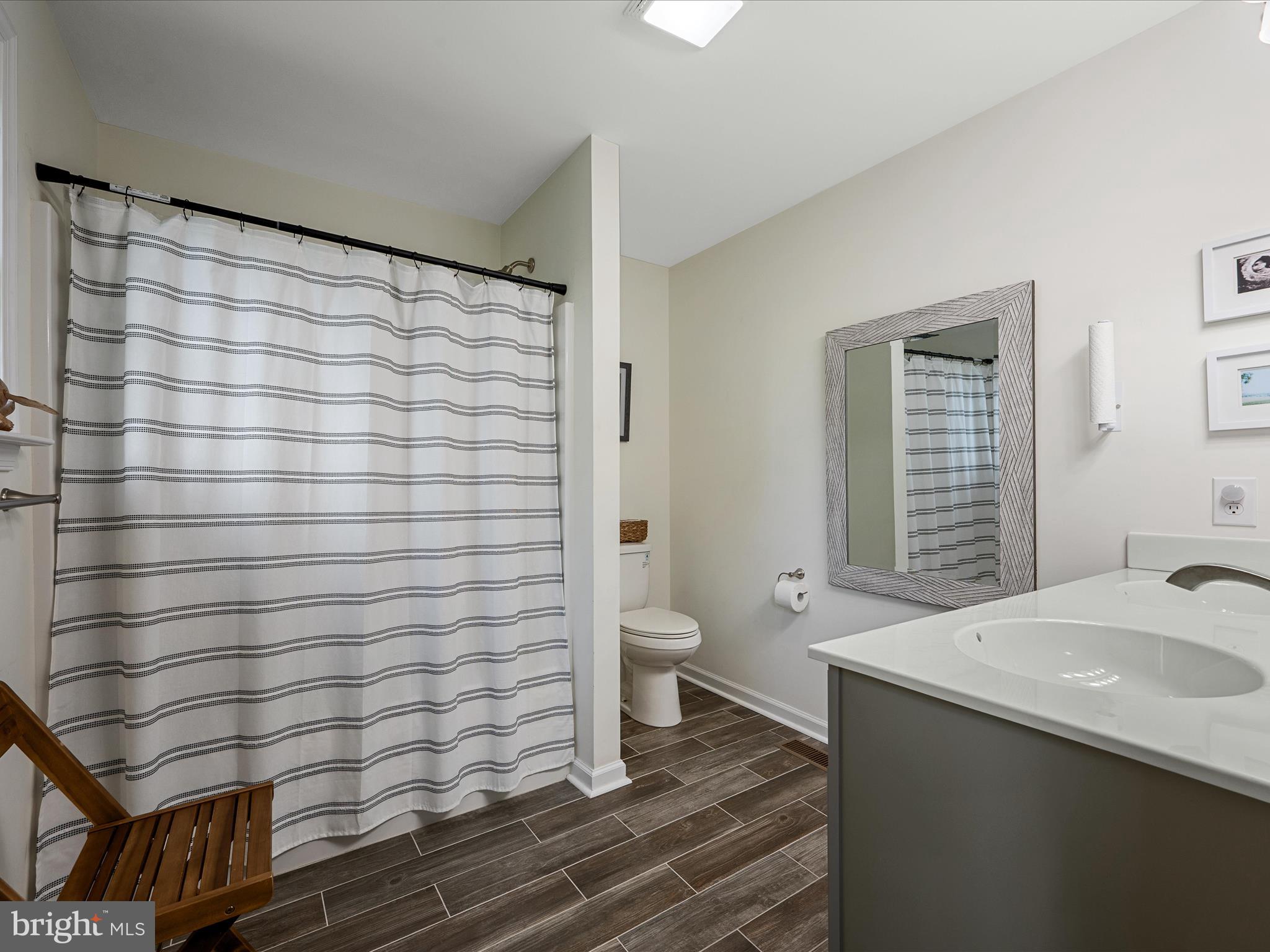 439 Windy Way Front Royal, VA 22630 - Photo 26 of 40 a bathroom with a sink and a mirror