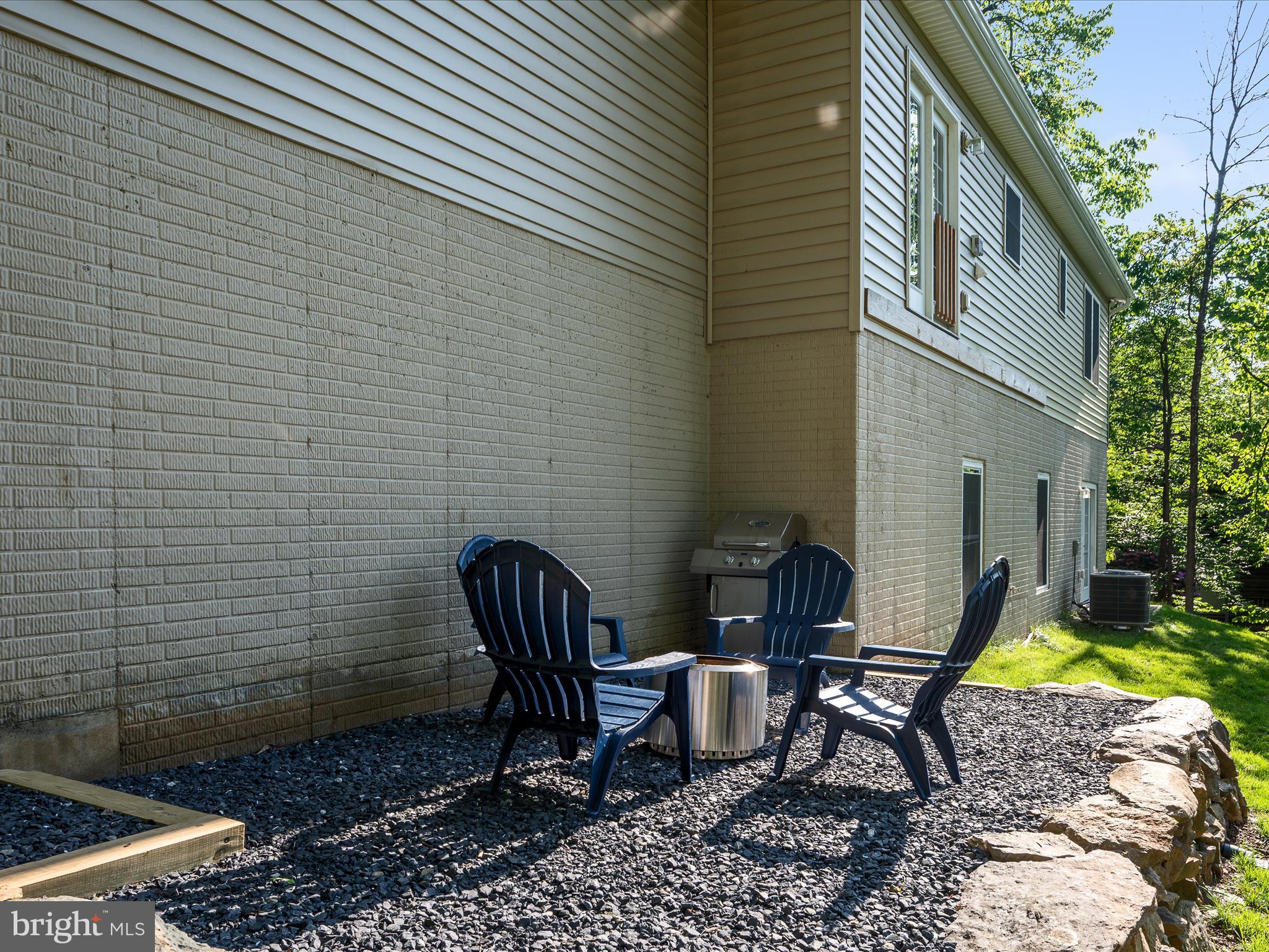 439 Windy Way Front Royal, VA 22630 - Photo 31 of 40 a view of a lounge chair and table in the backyard
