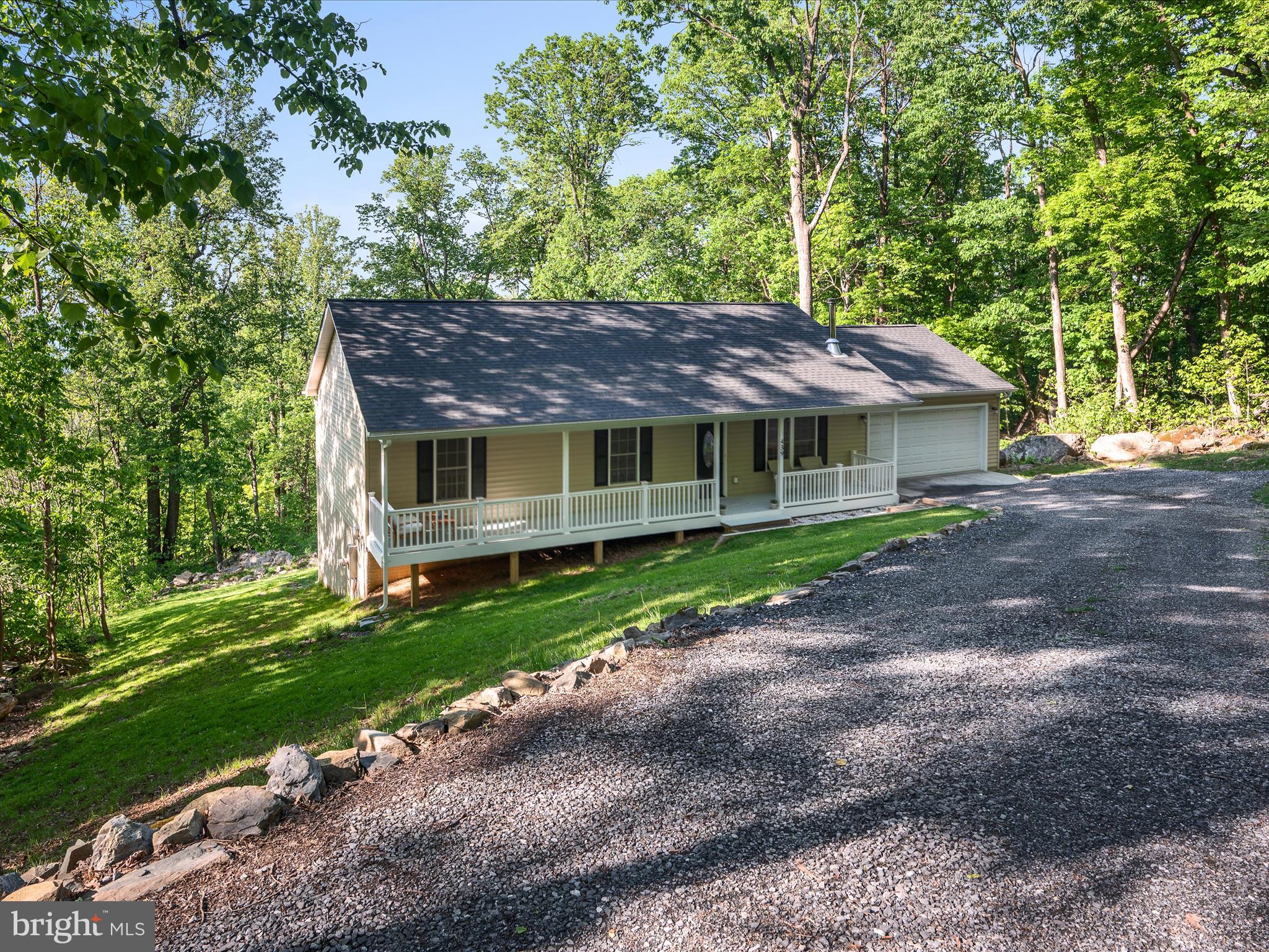 439 Windy Way Front Royal, VA 22630 - Photo 36 of 40 a front view of a house with a garden