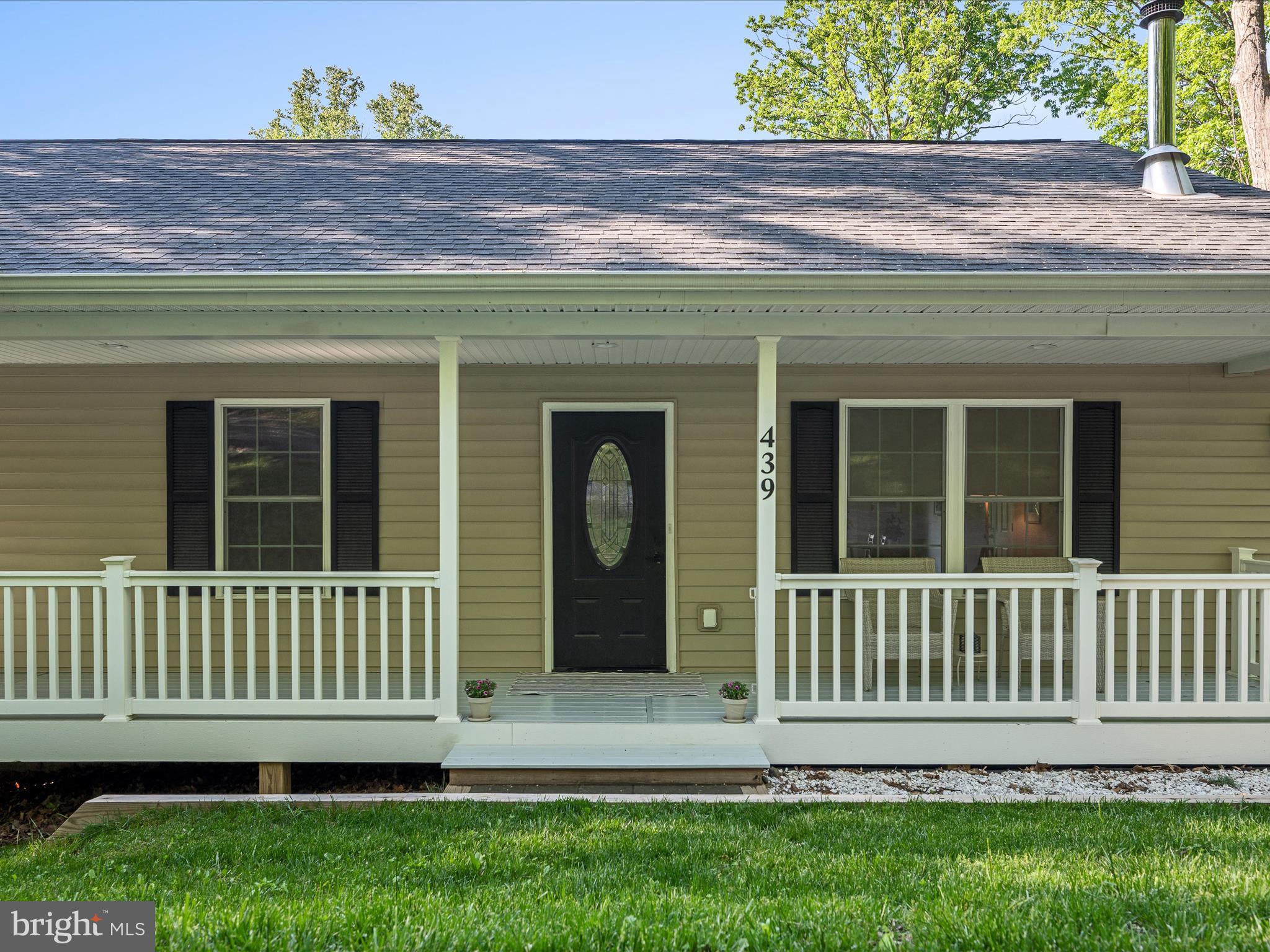 439 Windy Way Front Royal, VA 22630 - Photo 8 of 40 a view of a house with a small yard and wooden fence