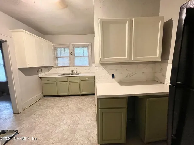 a utility room with washer and dryer