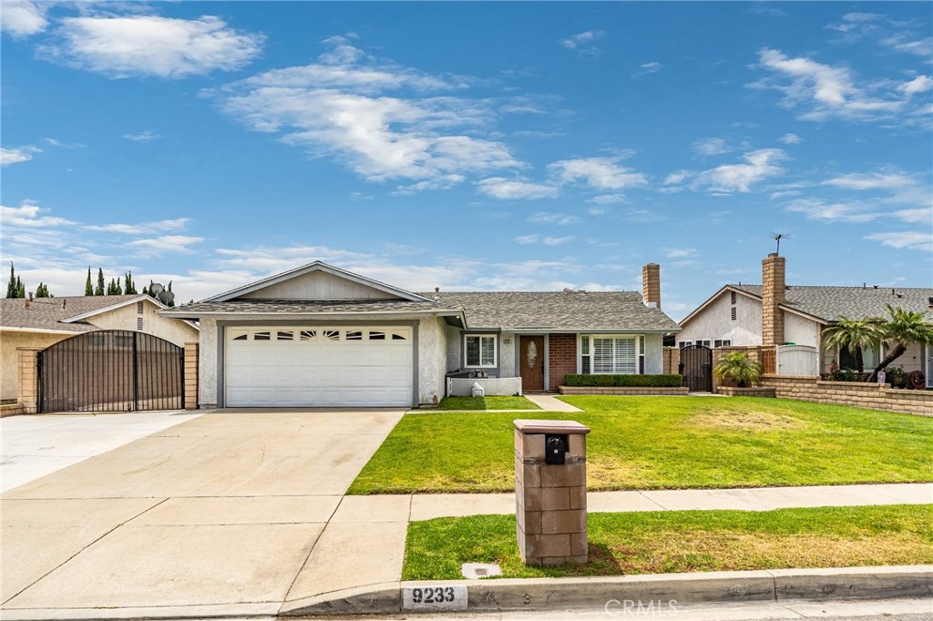 9233 Devon Street Rancho Cucamonga, CA 91730 - Photo 1 of 1 a front view of a house with a yard