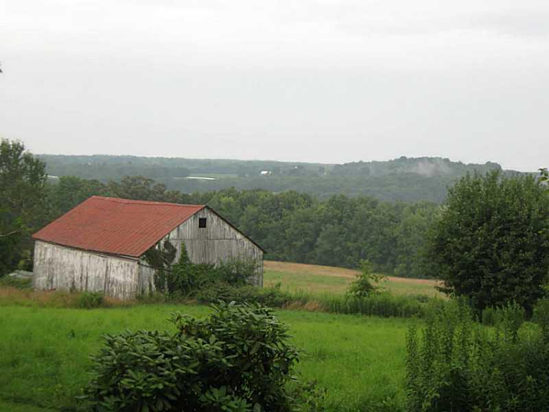 248 Patton Road Sandy Lake, PA 16145 - Photo 7 of 10 Stable/Barn. Looking past barn to pasture and woodlands.
