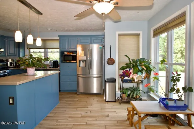 a kitchen with a table and chairs in it