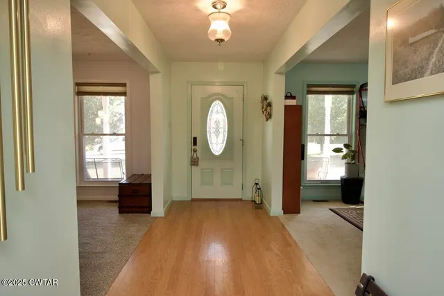 a living room with fireplace furniture and a flat screen tv