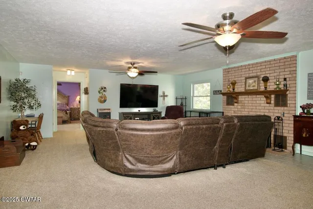 a living room with furniture and a fireplace