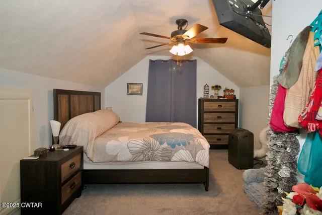 a room with furniture a air conditioner vent and a window