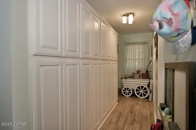 a view of a patio with table and chairs and potted plants