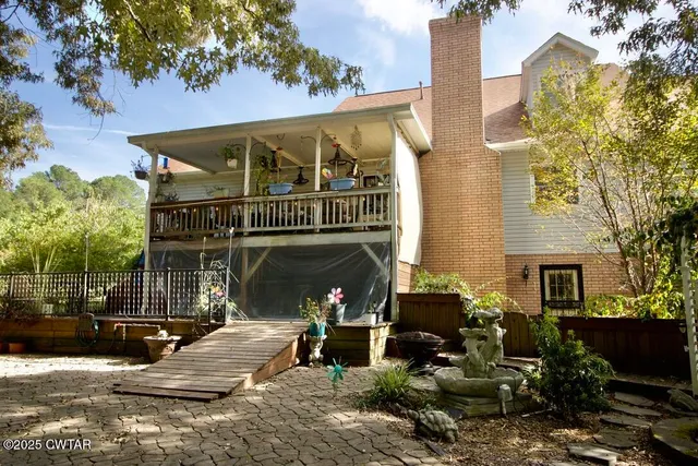 a view of a yard with chairs