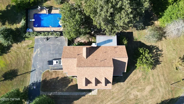 a view of a yard with a tree