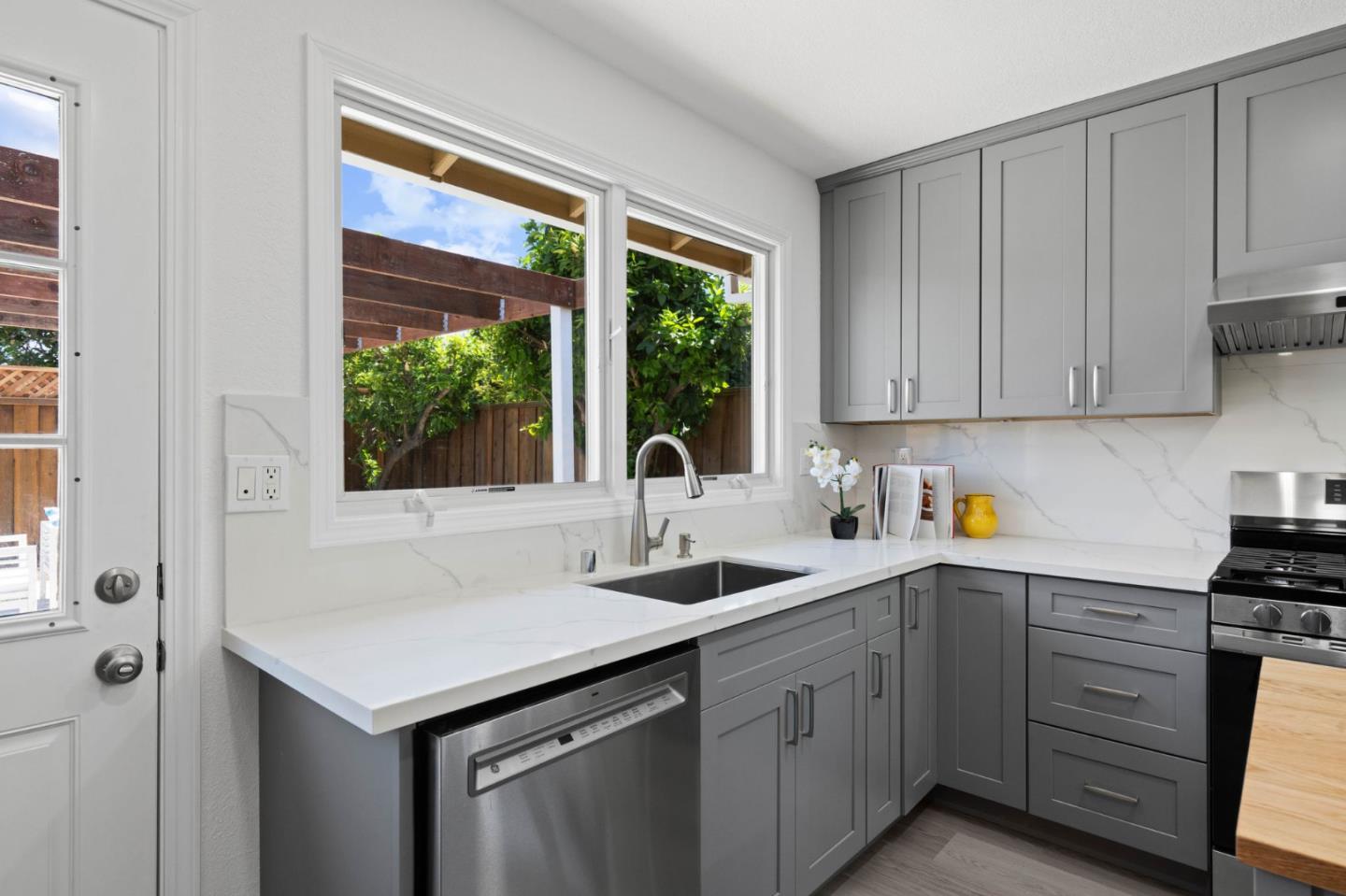 960 Cheswick Drive San Jose, CA 95121 - Photo 12 of 44 a kitchen with sink cabinets and window