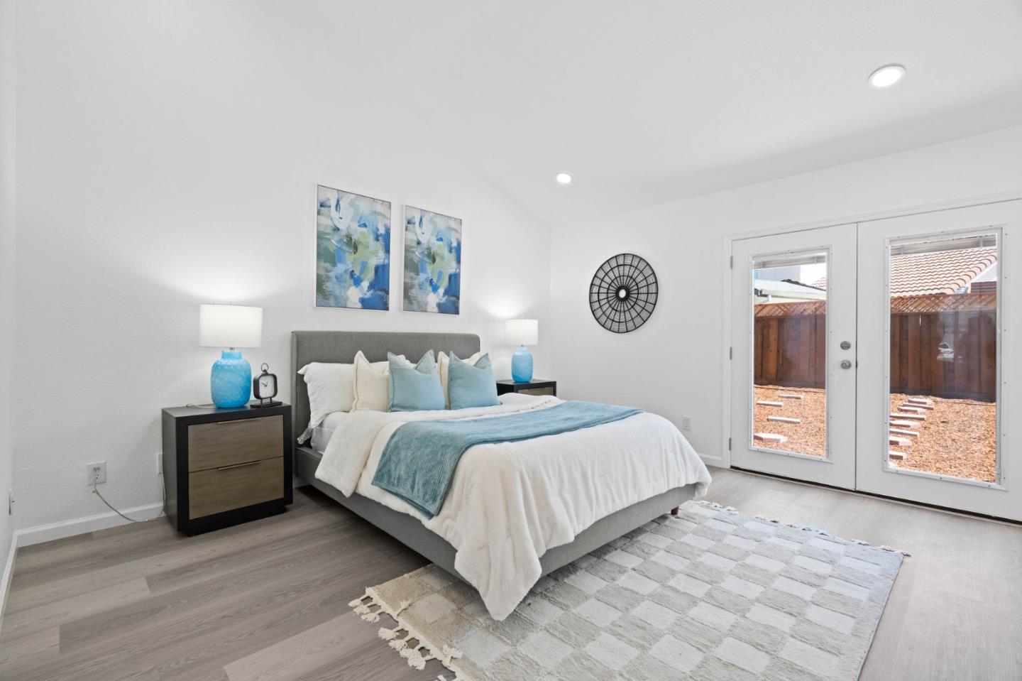 960 Cheswick Drive San Jose, CA 95121 - Photo 18 of 44 a bedroom with a large bed and a large window