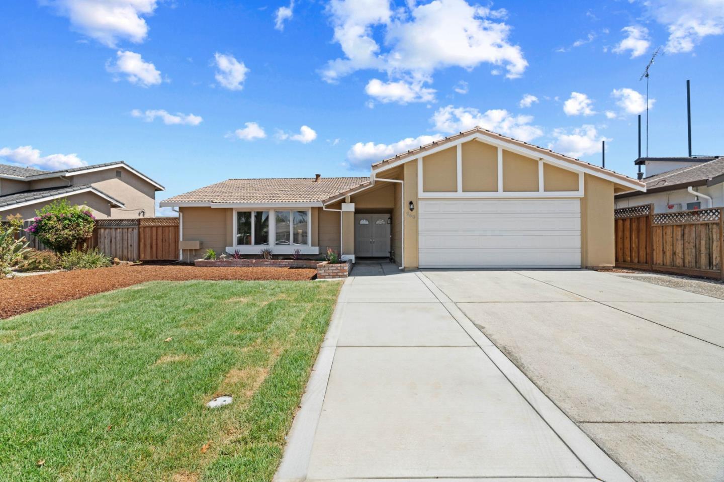 960 Cheswick Drive San Jose, CA 95121 - Photo 2 of 44 a front view of a house with a garden and yard