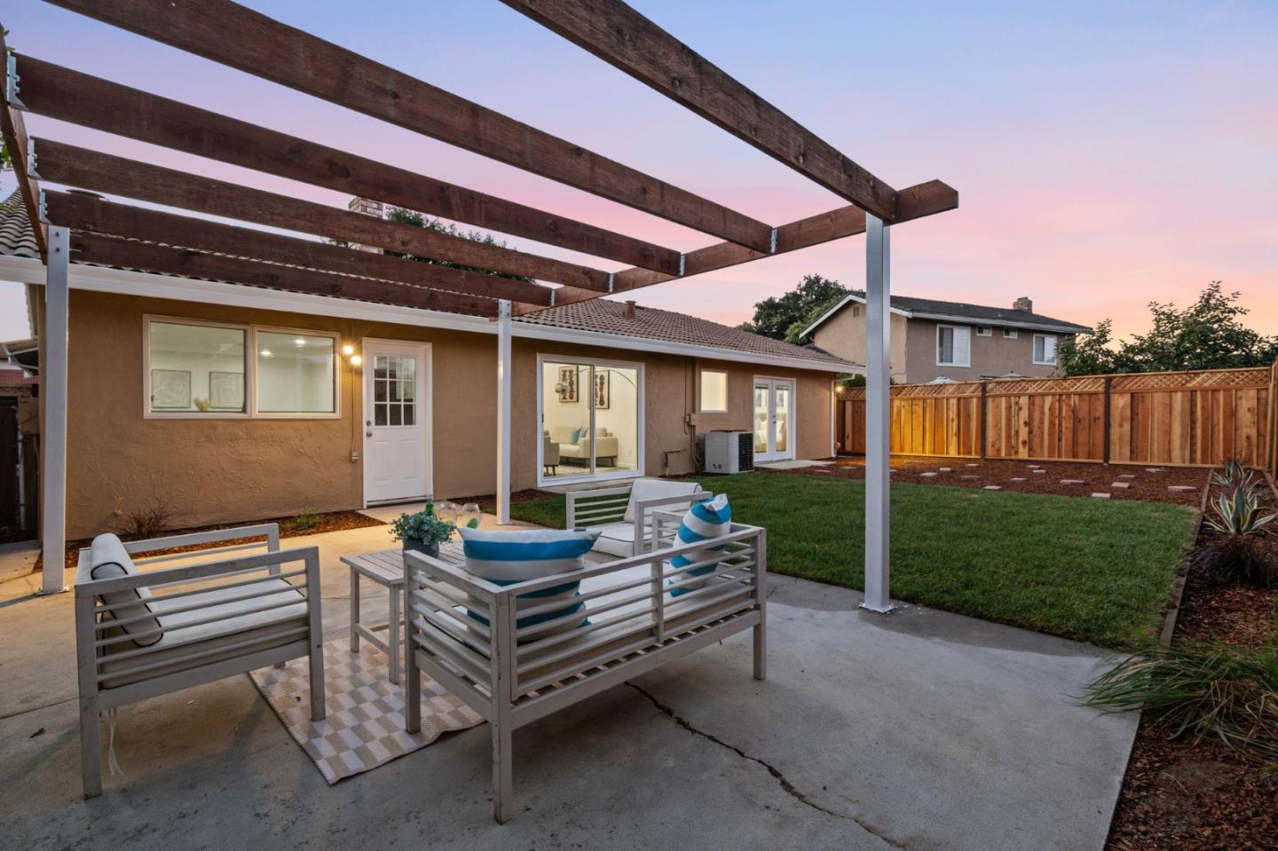960 Cheswick Drive San Jose, CA 95121 - Photo 43 of 44 a patio with a table and chairs and a yard