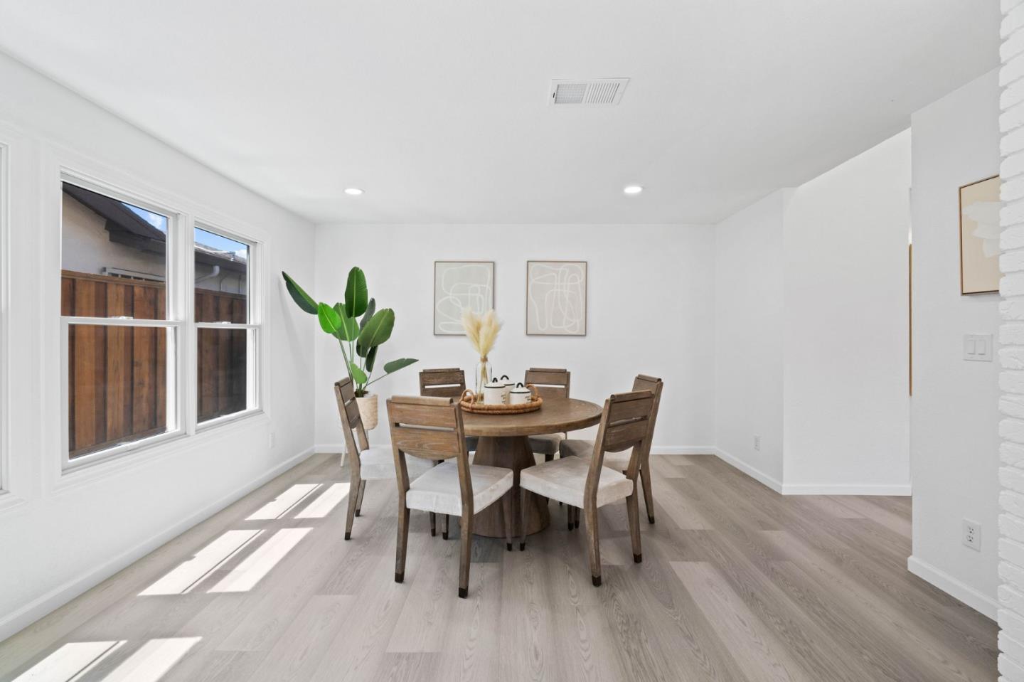 960 Cheswick Drive San Jose, CA 95121 - Photo 7 of 44 a view of a dining room with furniture window and wooden floor