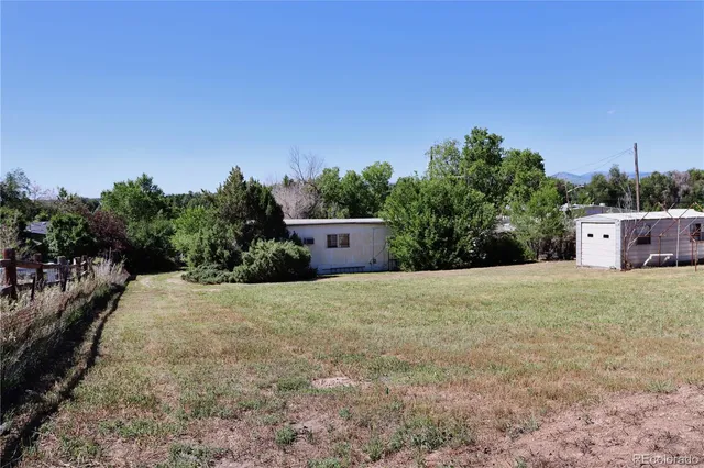 a view of a entryway door with wooden floor