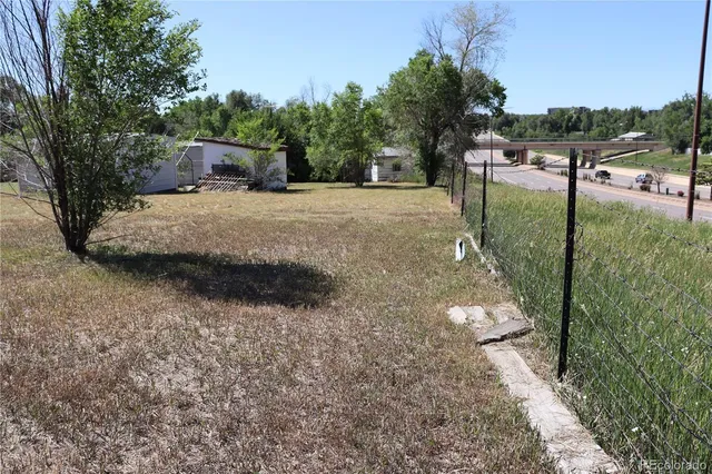 a kitchen with granite countertop a stove and a shower