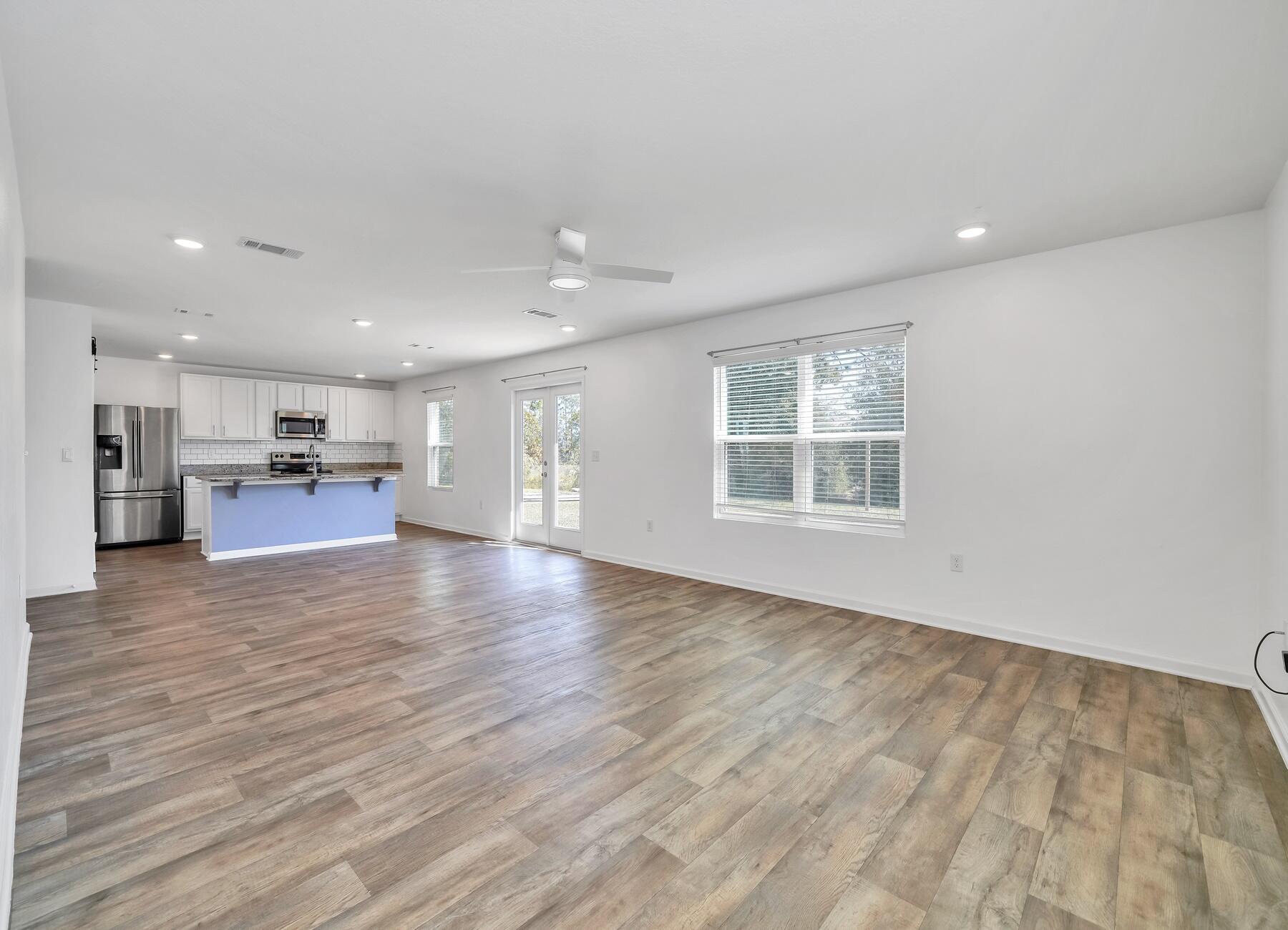 955 Merganser Way Crestview, FL 32539 - Photo 13 of 34 a view of kitchen and hall with wooden floor