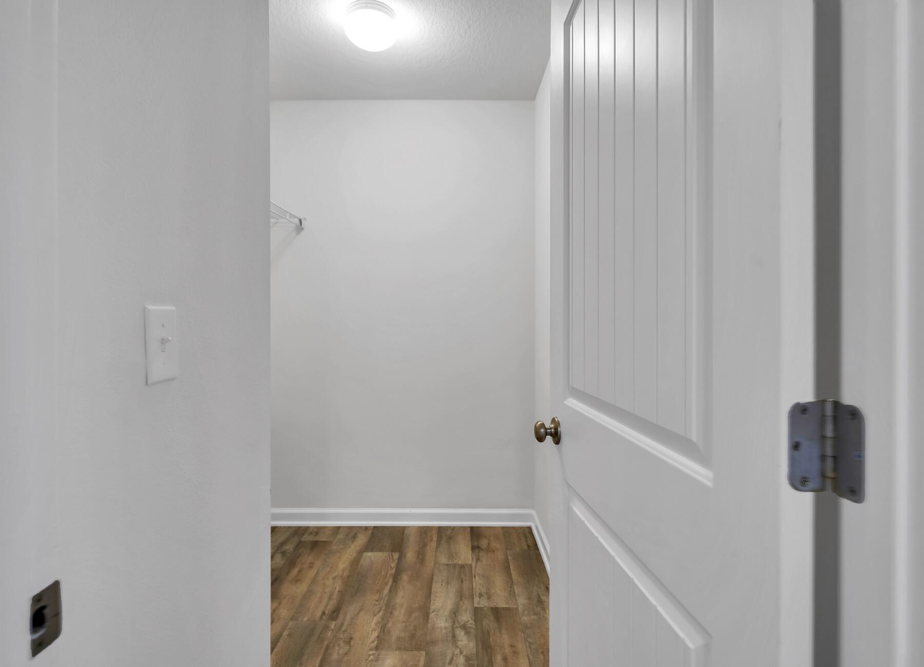 955 Merganser Way Crestview, FL 32539 - Photo 18 of 34 a view of small space with racks on the wall