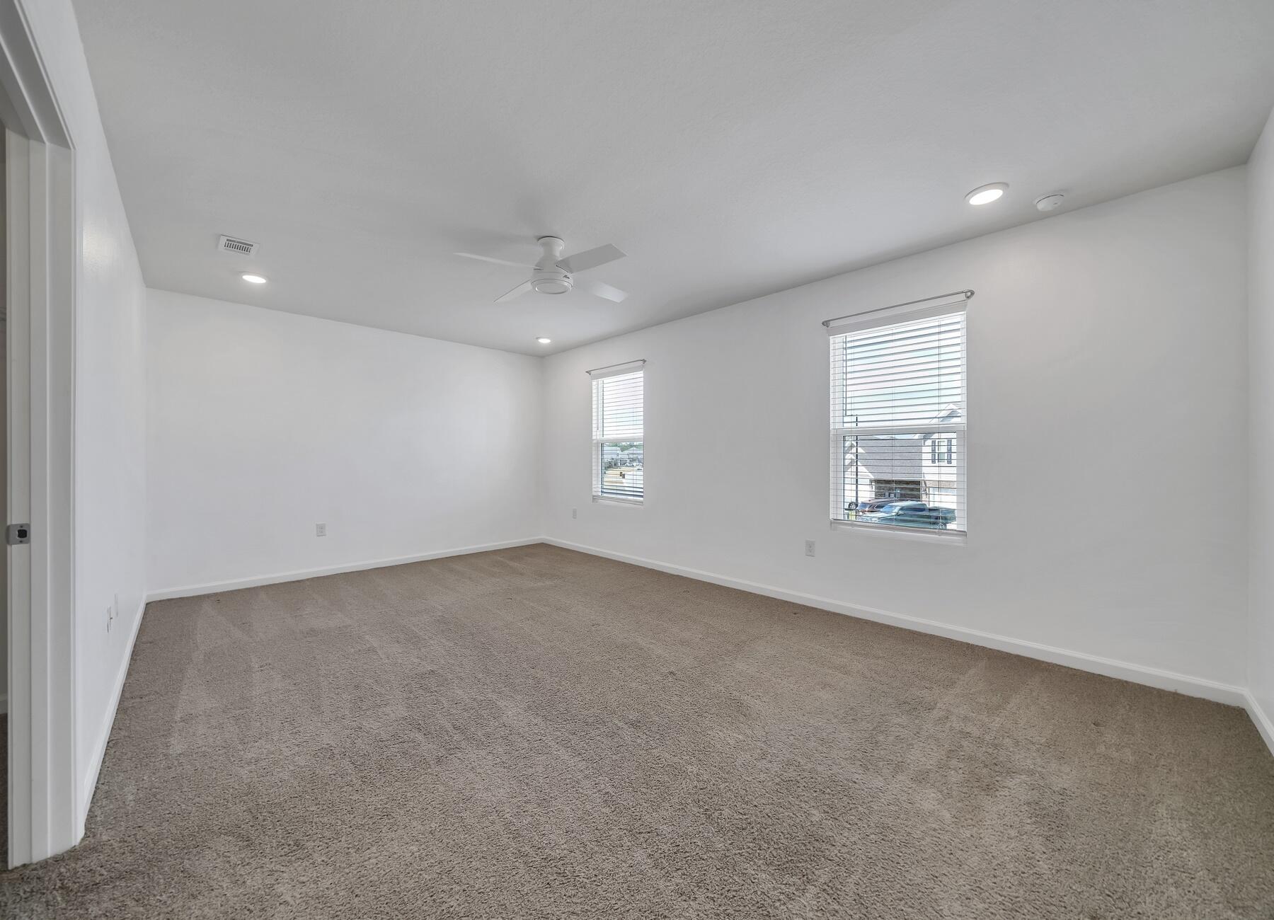 955 Merganser Way Crestview, FL 32539 - Photo 24 of 34 an empty room with windows and closet