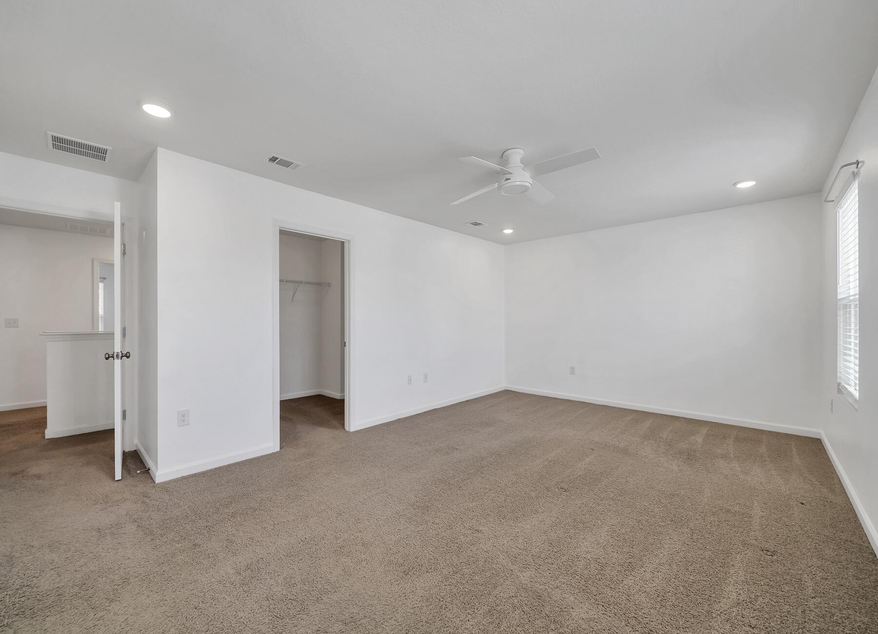 955 Merganser Way Crestview, FL 32539 - Photo 25 of 34 an empty room with closet and a window