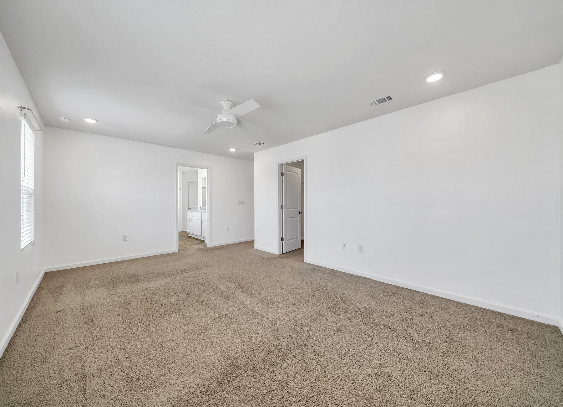 955 Merganser Way Crestview, FL 32539 - Photo 26 of 34 an empty room with an entryway and fan