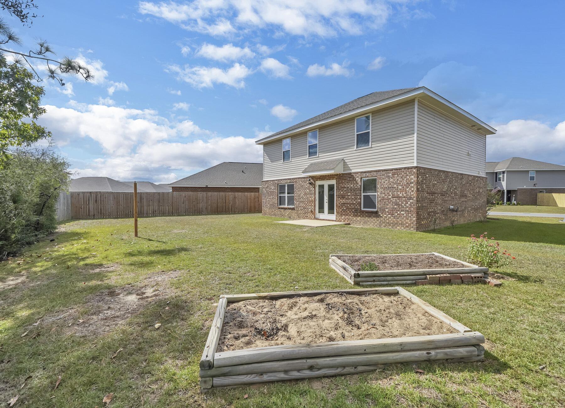 955 Merganser Way Crestview, FL 32539 - Photo 33 of 34 a view of a house with a yard