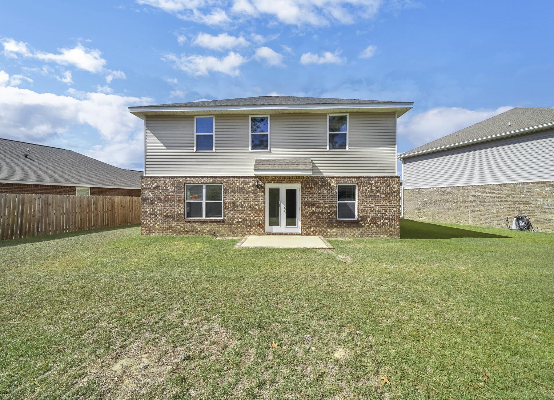 955 Merganser Way Crestview, FL 32539 - Photo 34 of 34 a backyard of a house