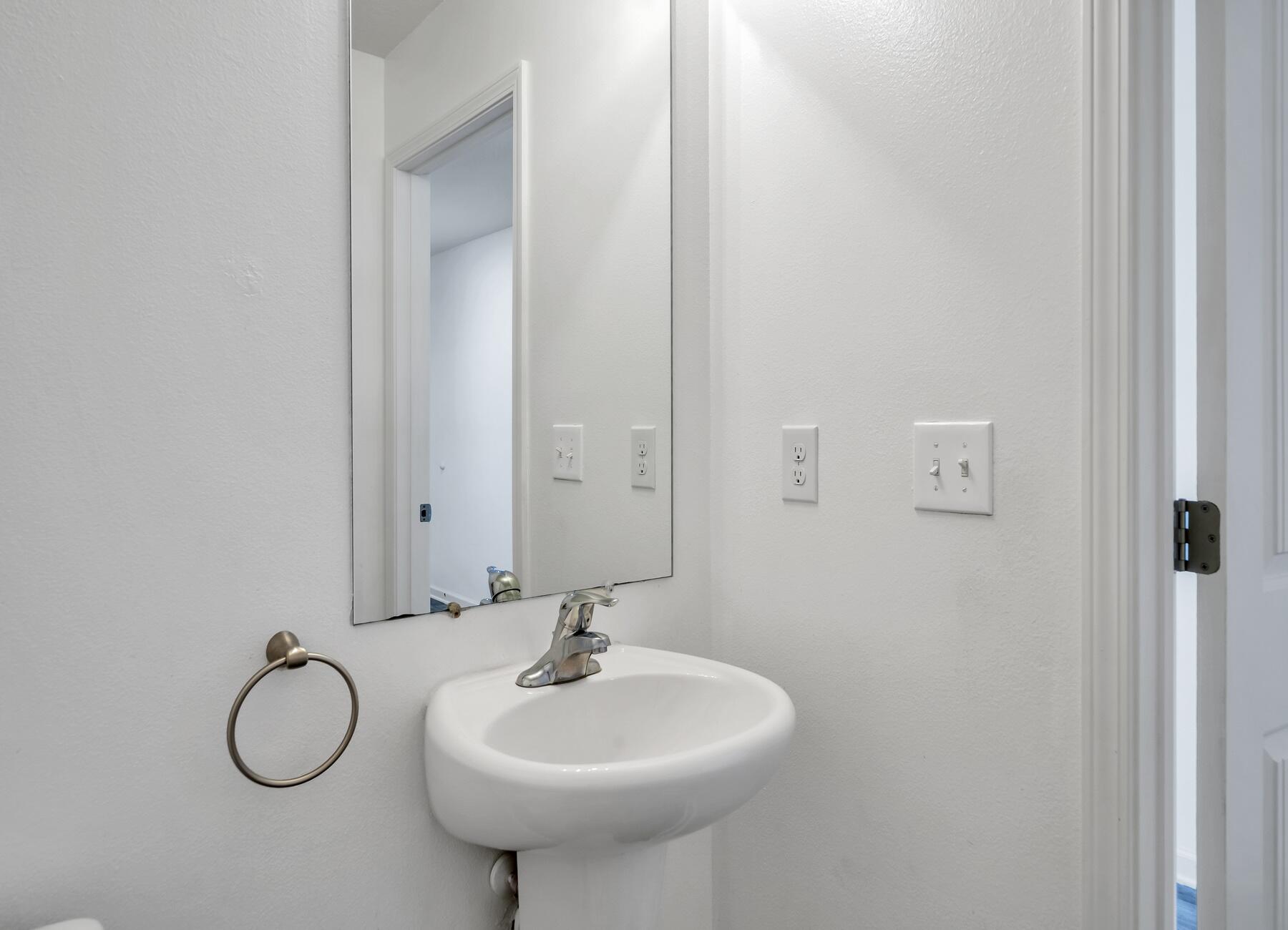 955 Merganser Way Crestview, FL 32539 - Photo 4 of 34 a bathroom with a sink and a mirror