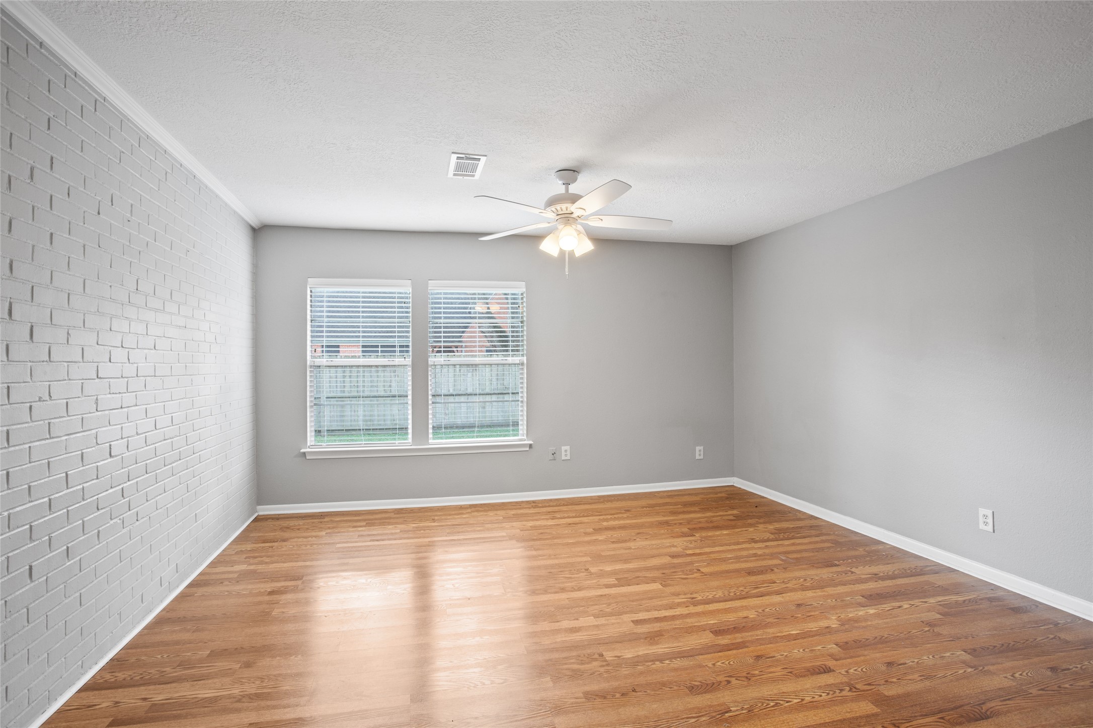 302 South Hardie Street Alvin, TX 77511 - Photo 6 of 16 Primary bedroom in the back of the home.