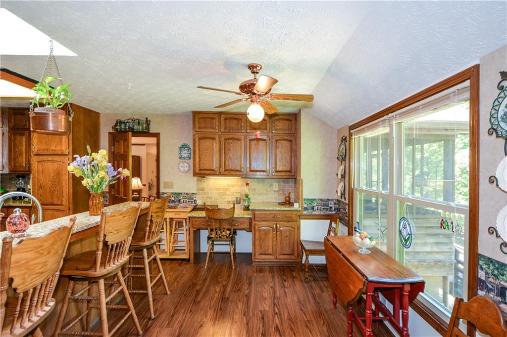 130 Hawn Road Fayetteville, GA 30215 - Photo 12 of 67 a dining room with furniture and wooden floor