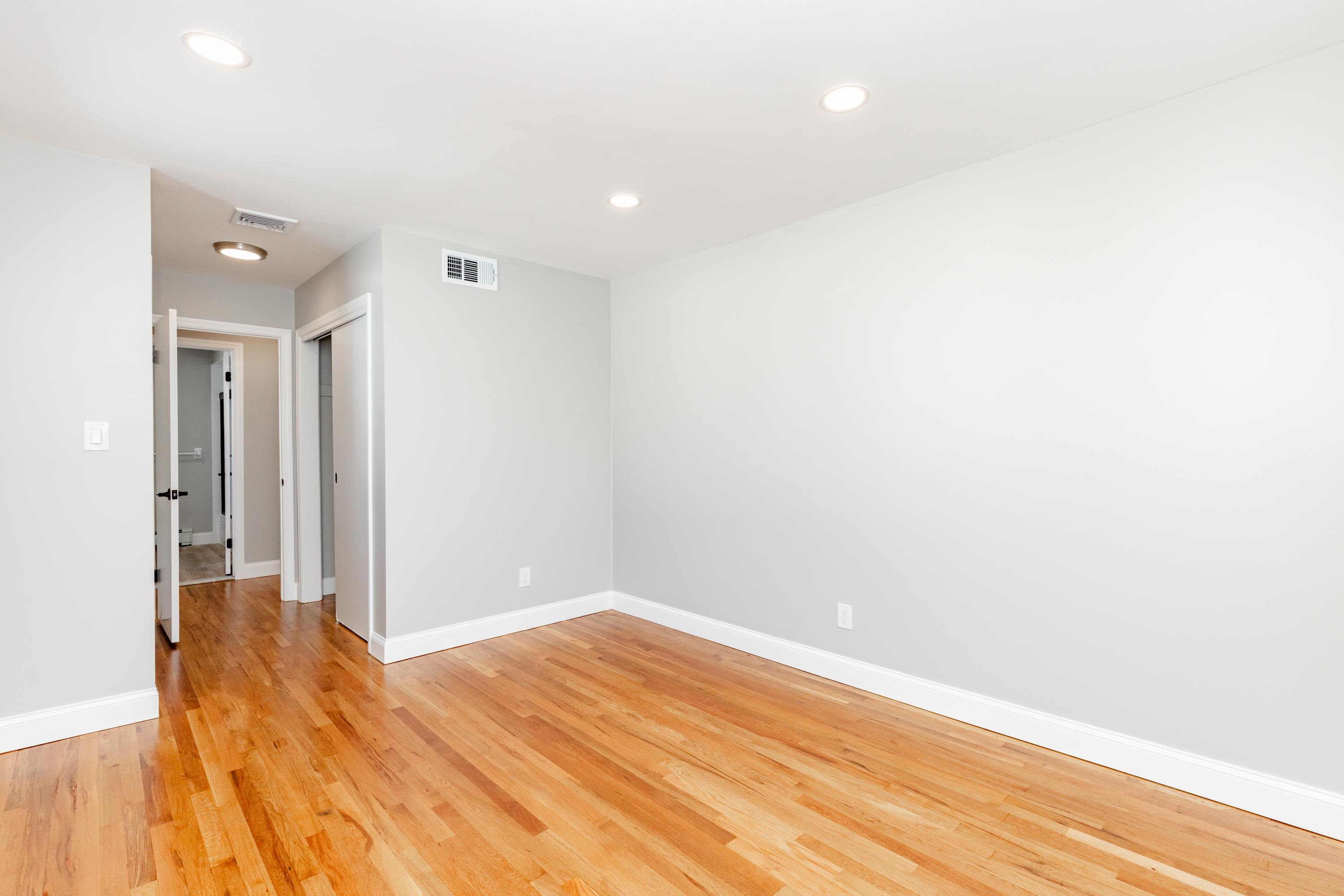 100 Lakeview Avenue, Unit 2A Clifton, NJ 07011 - Photo 10 of 13 a view of empty room with wooden floor