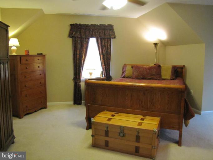 13046 Independence Road Clear Spring, MD 21722 - Photo 13 of 26 a bedroom with a bed and wooden floor